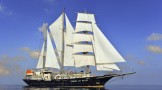 Sailing yacht RUNNING ON WAVES